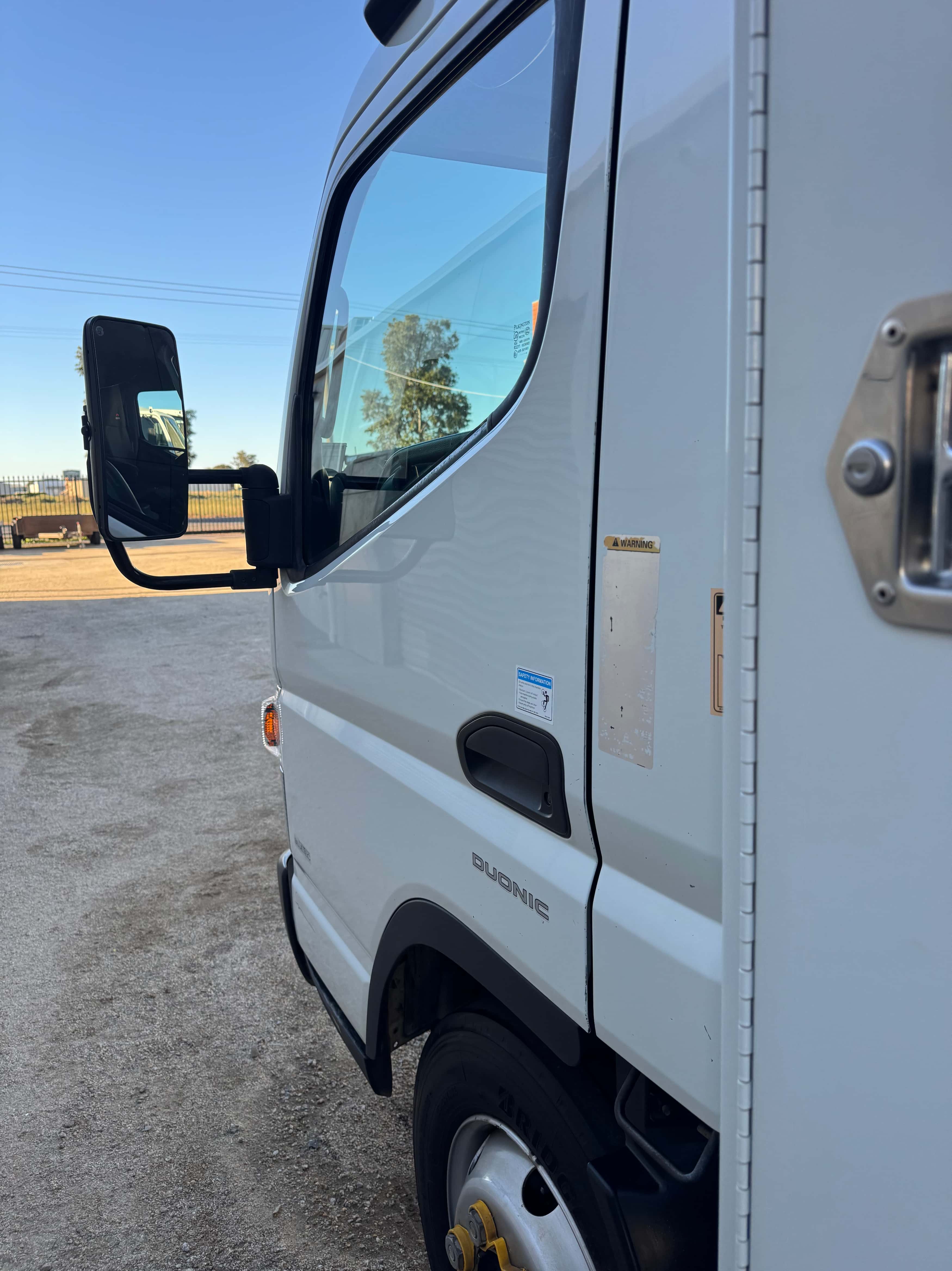 Work truck driver side after detailing by Domma's Detailing